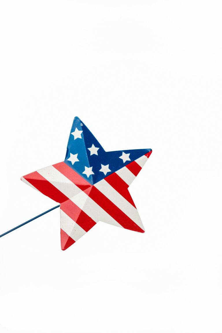 A star-shaped decoration with American flag pattern symbolizing Independence Day on a stick.